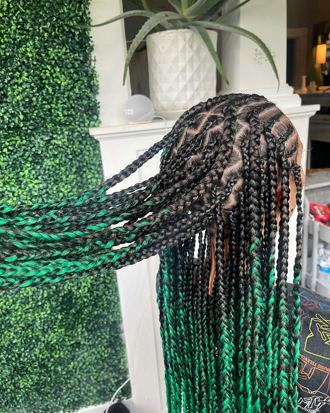 35. Black Tribal Braids With Green Tips