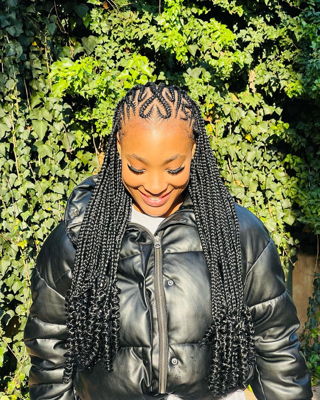 20. Heart-shaped Shaped Tribal Cornrow Braids With Curly Ends