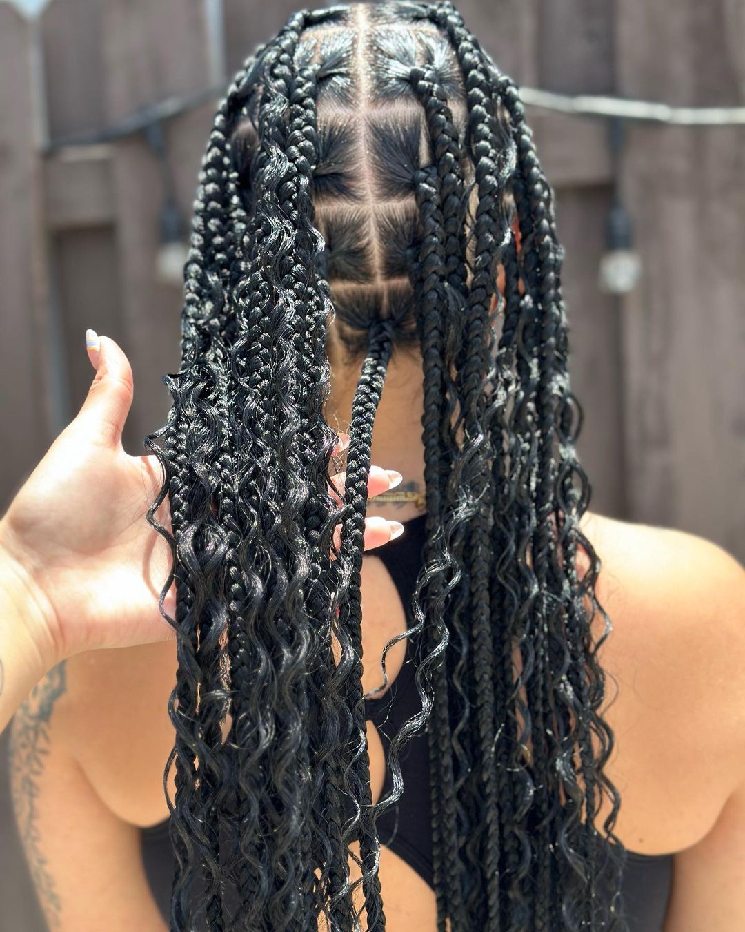 14. Scanty Knotless Braids With Boho Curls