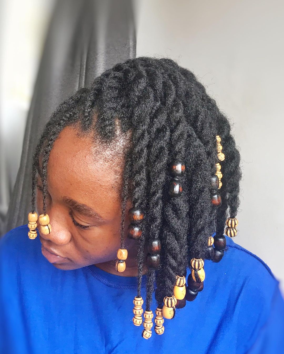 36. Short Twists on Natural Hair With Traditional Beads at The End