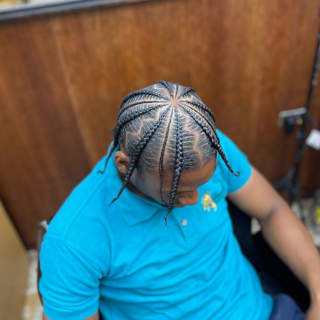 2. Hat Cornrows With Zig Zag Parting